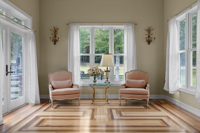 sitting room featuring light parquet flooring