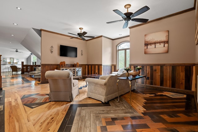 living room featuring a wealth of natural light, ornamental molding, and hardwood / wood-style flooring