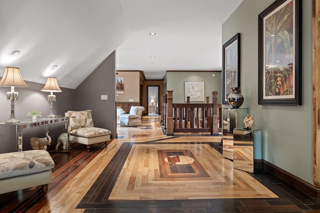 corridor featuring wood-type flooring and lofted ceiling