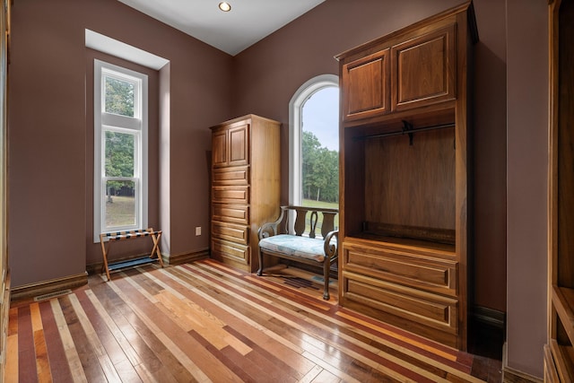 unfurnished room with wood-type flooring