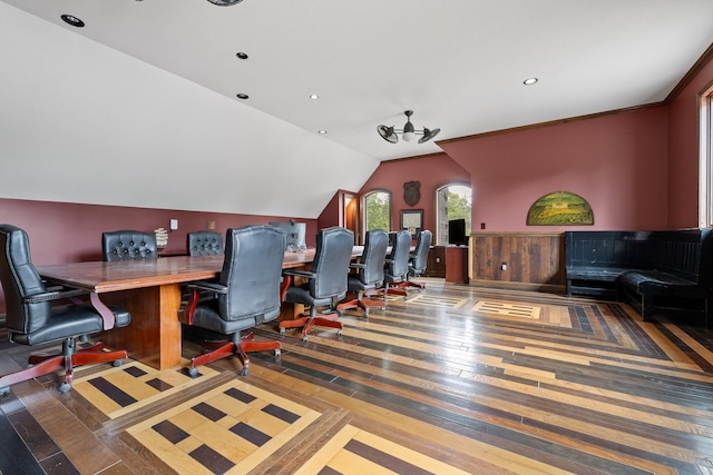 office area with dark wood-type flooring and vaulted ceiling