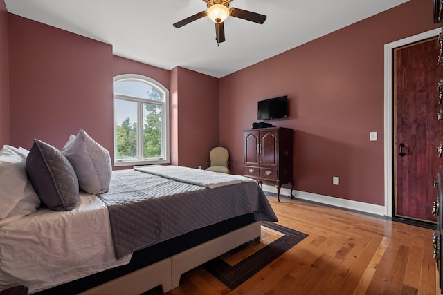 bedroom featuring ceiling fan and light hardwood / wood-style floors