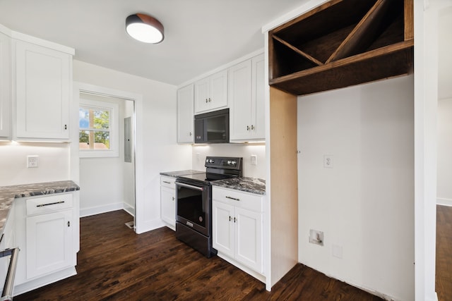 kitchen with white cabinets, dark stone counters, and electric stove