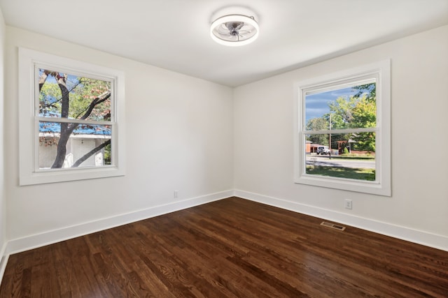 spare room featuring hardwood / wood-style floors