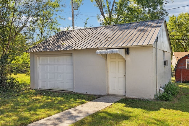 garage with a lawn