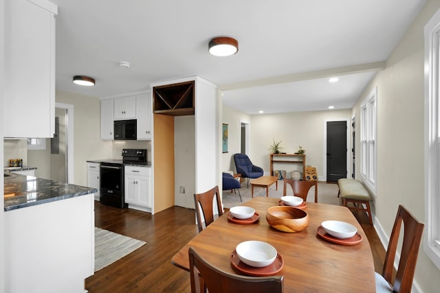 dining room with dark wood-type flooring