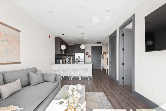 living room featuring dark hardwood / wood-style flooring