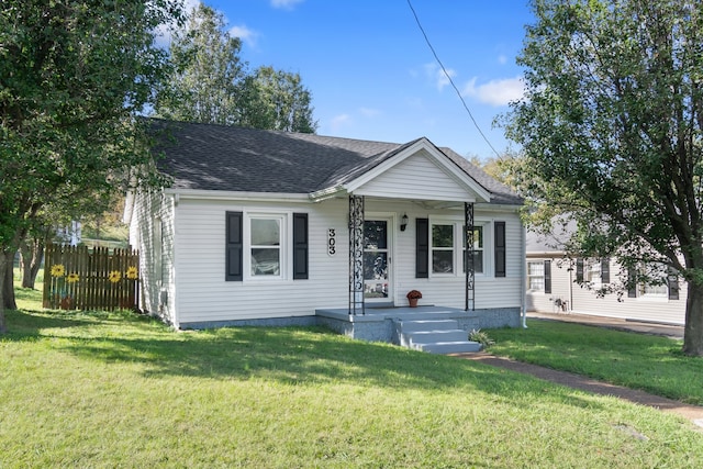 bungalow-style home featuring a front yard