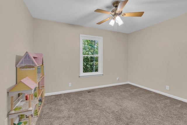 recreation room featuring carpet floors and ceiling fan