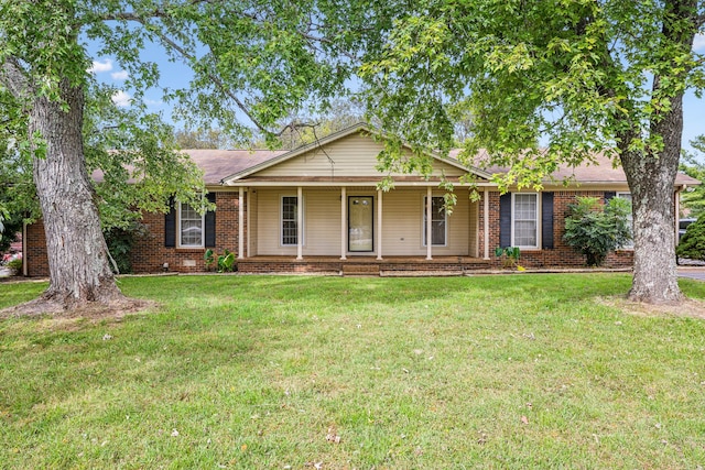 ranch-style home featuring a front yard and a porch