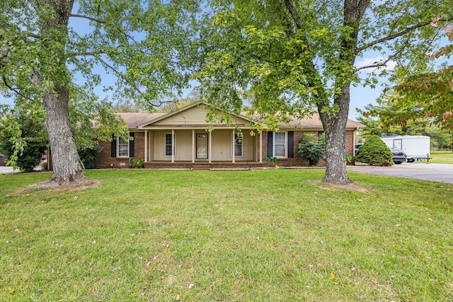 single story home with a porch and a front yard