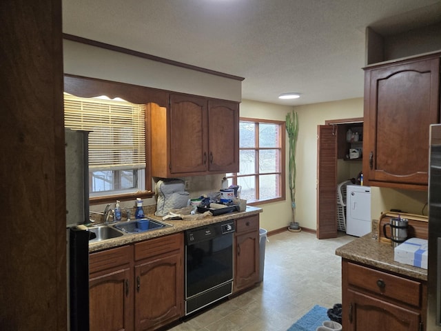 kitchen featuring sink, a textured ceiling, black dishwasher, and refrigerator