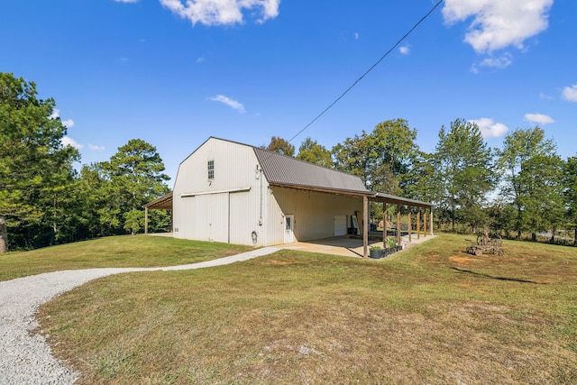 view of home's exterior with a carport and a lawn