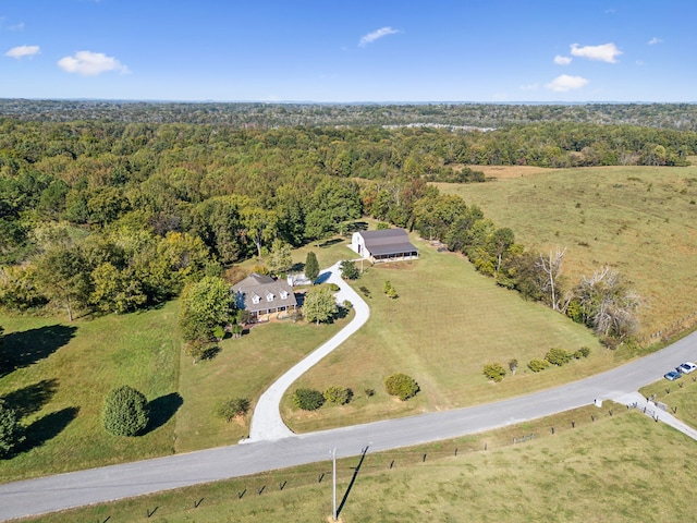 birds eye view of property with a rural view