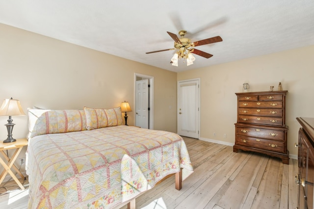 bedroom featuring light hardwood / wood-style flooring and ceiling fan