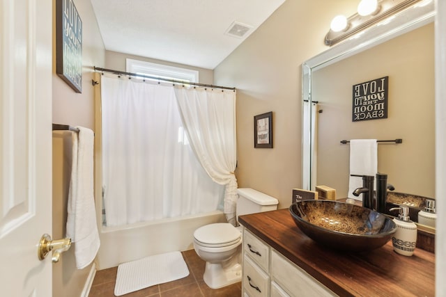 full bathroom featuring shower / tub combo with curtain, tile patterned flooring, vanity, and toilet