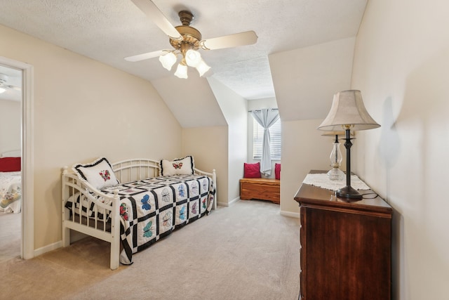 carpeted bedroom with ceiling fan, a textured ceiling, and lofted ceiling