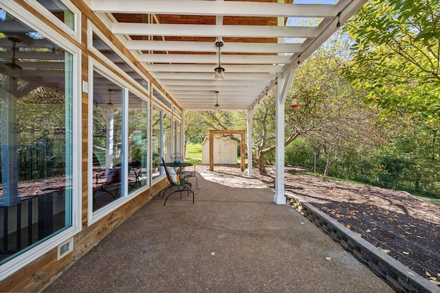 view of patio / terrace featuring a storage unit