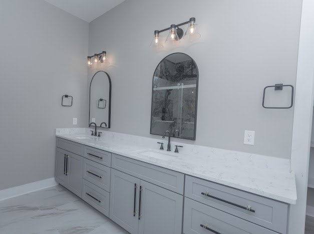 bathroom with walk in shower and vanity