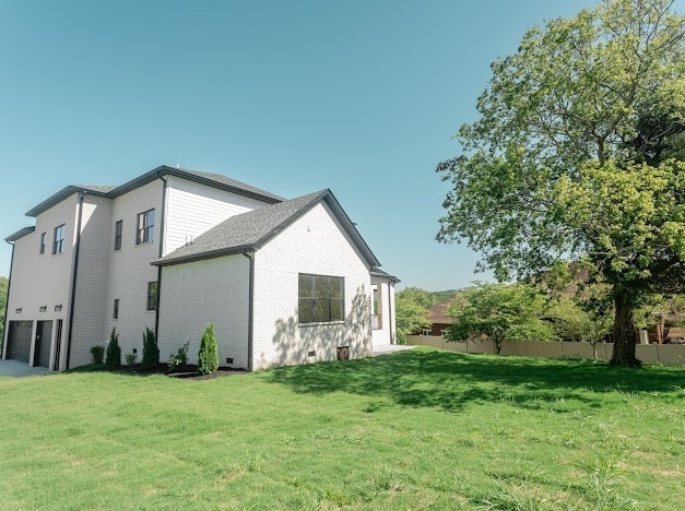 view of home's exterior featuring a yard