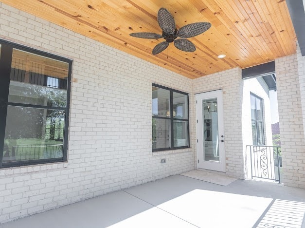 exterior space featuring ceiling fan