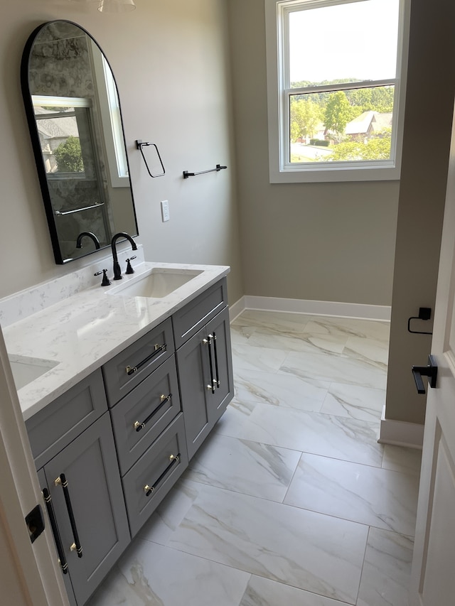 bathroom with a wealth of natural light and vanity