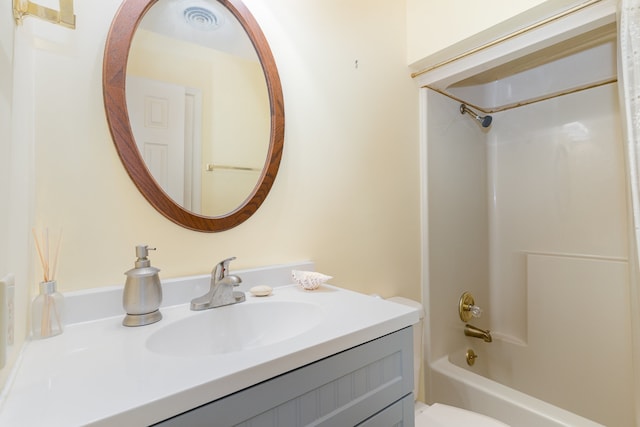 full bathroom featuring shower / bath combination, toilet, and vanity