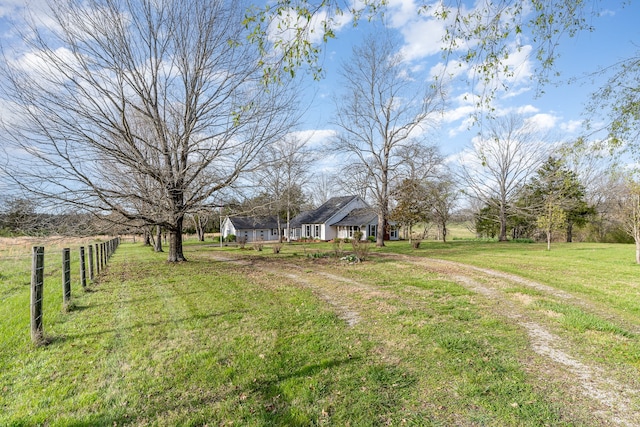 view of yard with a rural view