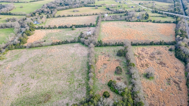 birds eye view of property with a rural view