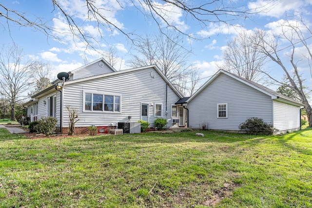 back of house featuring a yard