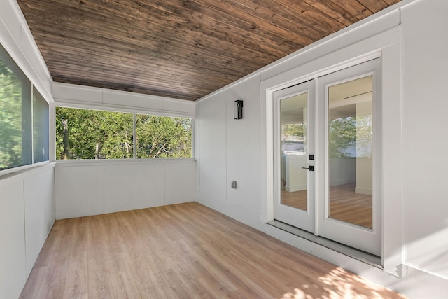 unfurnished sunroom with french doors and wooden ceiling