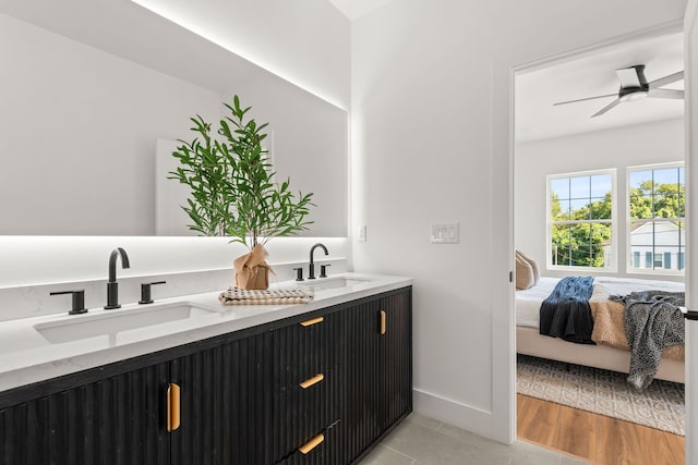 bathroom featuring ceiling fan, vanity, and hardwood / wood-style flooring