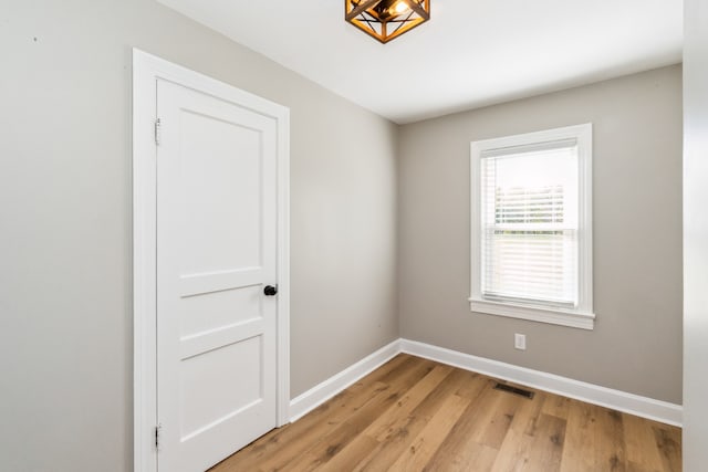 empty room with light wood-type flooring