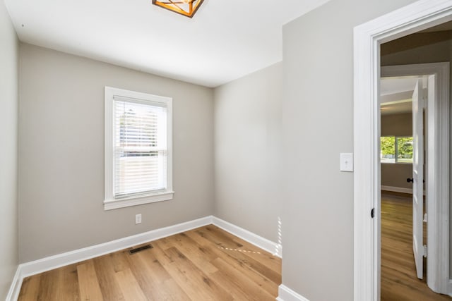 unfurnished room featuring light hardwood / wood-style flooring