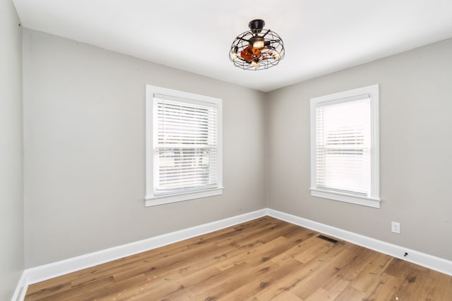 spare room featuring light hardwood / wood-style floors