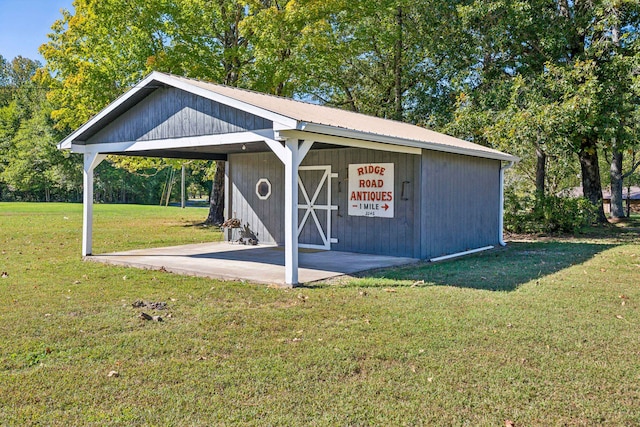 view of outdoor structure featuring a lawn