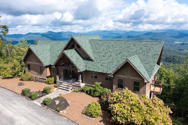 view of front of house with covered porch and a mountain view