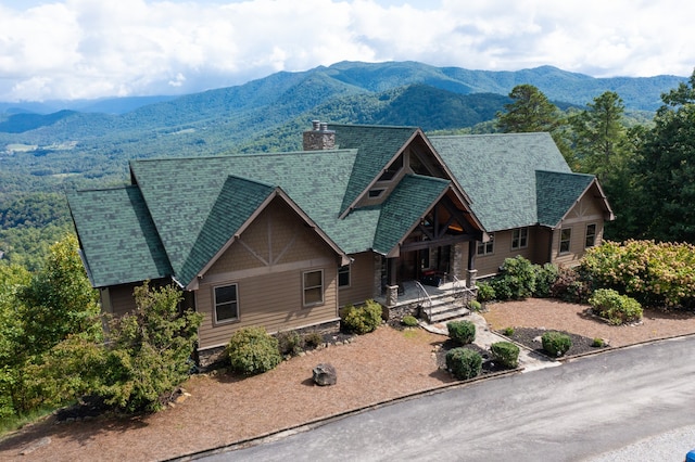 craftsman-style house with a porch and a mountain view