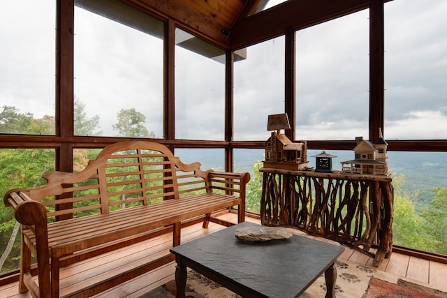 sunroom featuring lofted ceiling