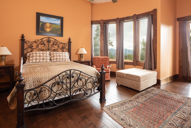 bedroom with hardwood / wood-style floors