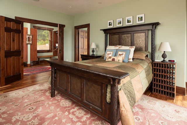 bedroom with wood-type flooring