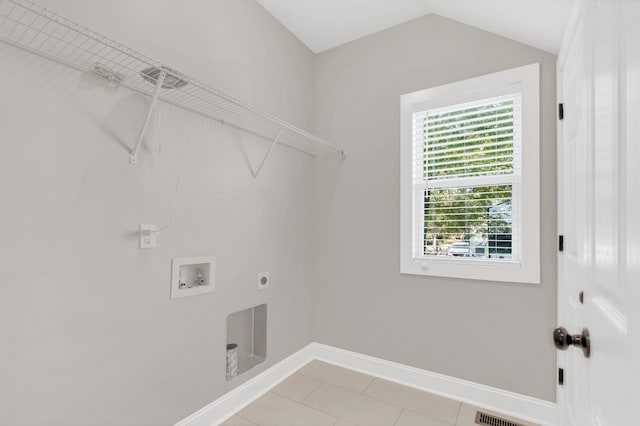 washroom featuring washer hookup, hookup for an electric dryer, and light tile patterned floors