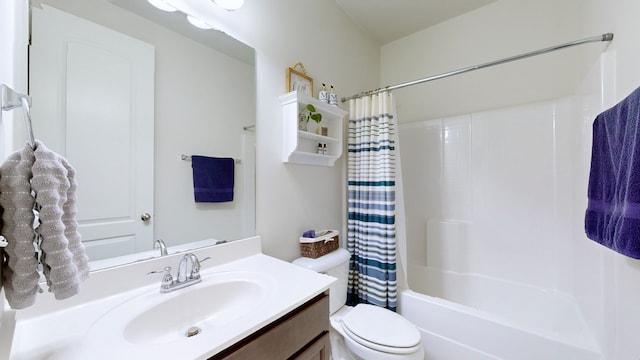 full bathroom featuring vanity, shower / tub combo, and toilet