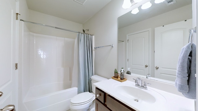 full bathroom featuring vanity, shower / bath combo, and toilet