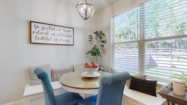 dining room with a notable chandelier