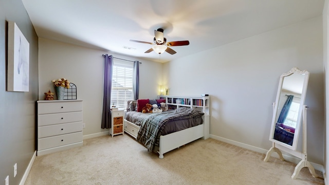 bedroom featuring light carpet and ceiling fan