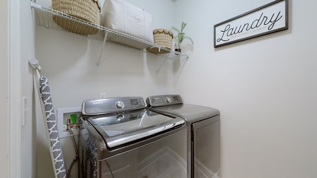 laundry area featuring washing machine and clothes dryer