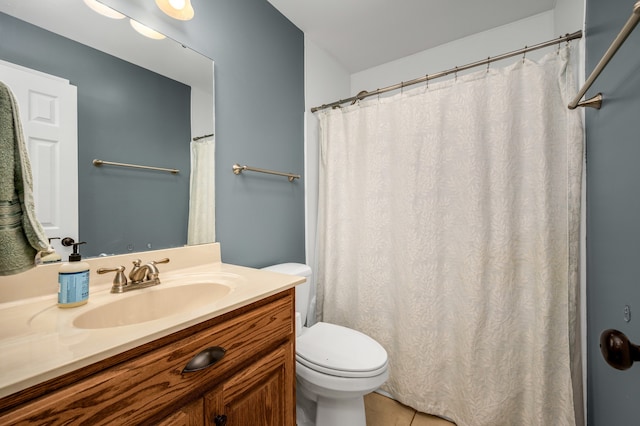 bathroom featuring vanity, tile patterned flooring, toilet, and a shower with shower curtain