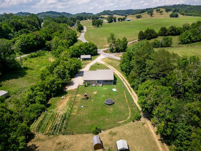 birds eye view of property with a rural view