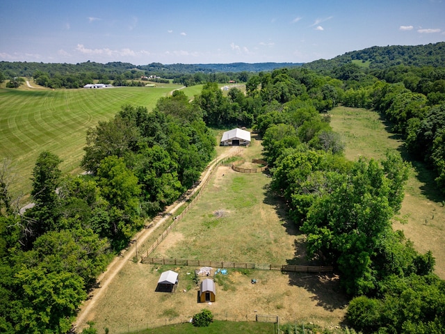 birds eye view of property with a rural view